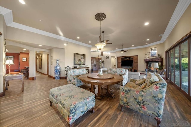 dining room featuring hardwood / wood-style floors, ceiling fan, and ornamental molding