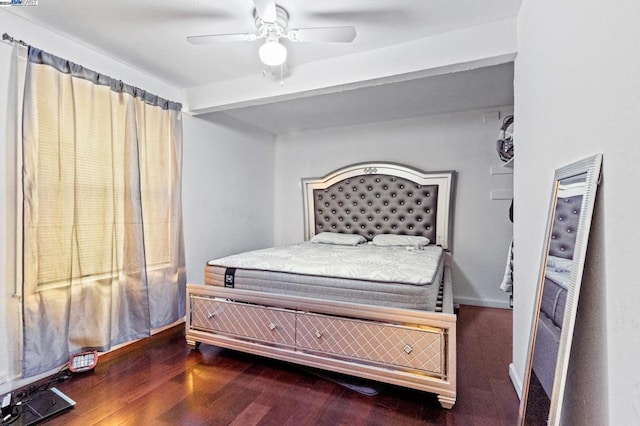 bedroom with ceiling fan, beamed ceiling, and hardwood / wood-style flooring