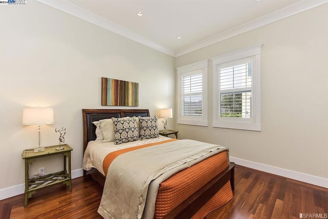 bedroom with dark hardwood / wood-style floors and crown molding