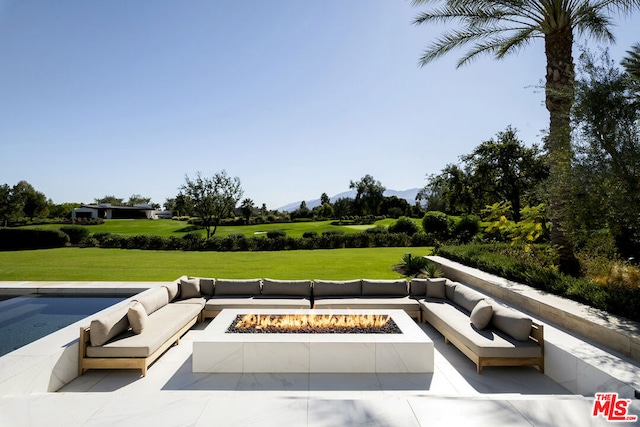 view of swimming pool with a fire pit, a patio, and a lawn