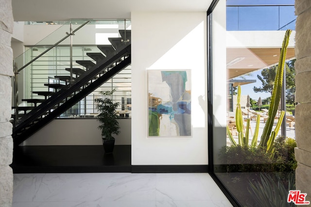 staircase with plenty of natural light