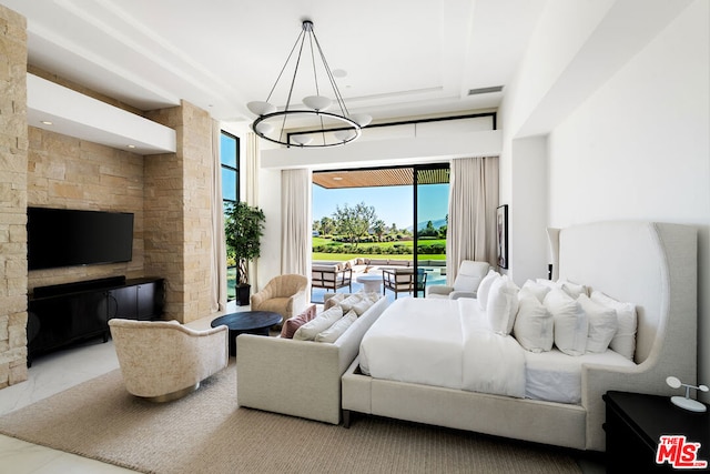 tiled bedroom featuring a chandelier