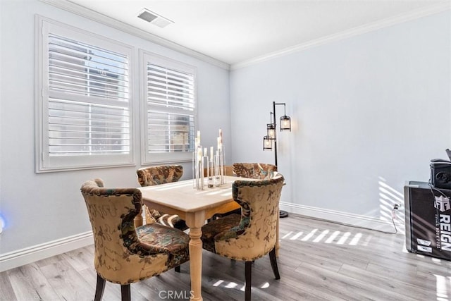 13559 Mashona Ave, Chino, CA 91710 - dining area with light wood-type flooring, ornamental molding, and baseboards