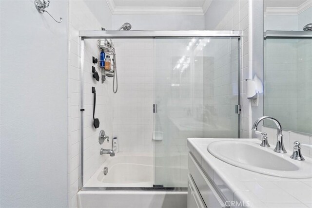 13559 Mashona Ave, Chino, CA 91710 - full bathroom with bath / shower combo with glass door, vanity, and crown molding