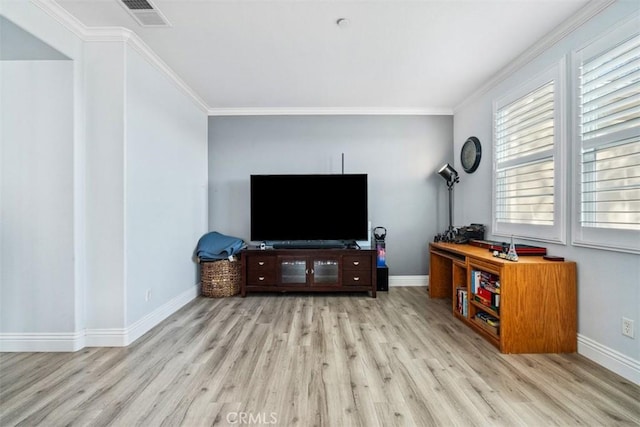 living room featuring crown molding and light hardwood / wood-style flooring