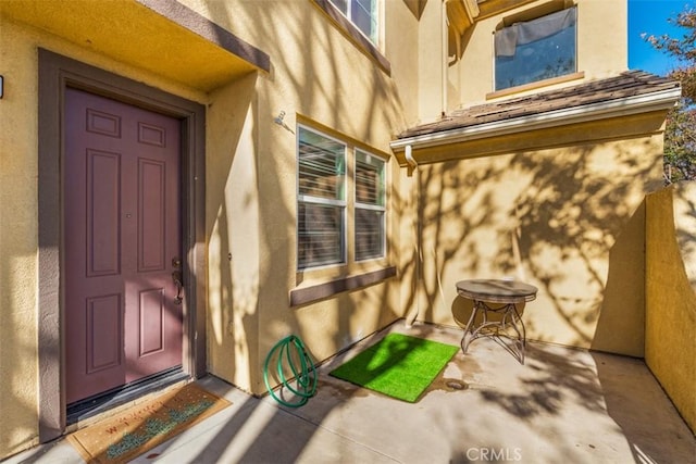 13559 Mashona Ave, Chino, CA 91710 - doorway to property featuring stucco siding