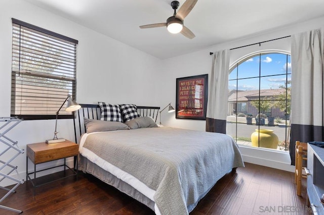 bedroom featuring ceiling fan and dark hardwood / wood-style floors