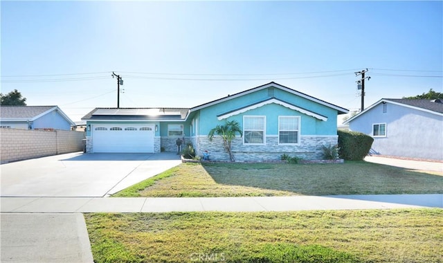 8121 San Mateo Cir, Buena Park, CA 90620 - ranch-style home featuring solar panels, a garage, and a front lawn