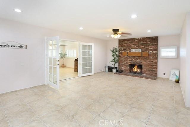 8121 San Mateo Cir, Buena Park, CA 90620 - unfurnished living room with a fireplace, french doors, and ceiling fan