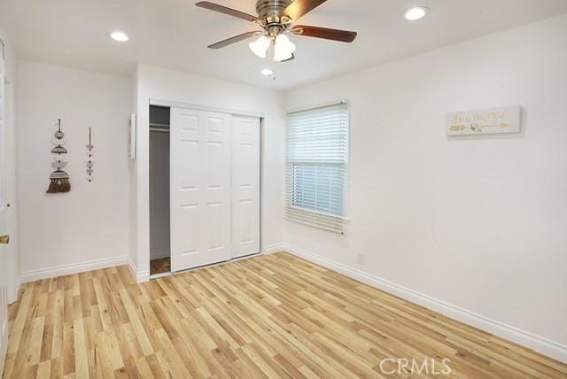8121 San Mateo Cir, Buena Park, CA 90620 - unfurnished bedroom with baseboards, light wood-style flooring, a closet, recessed lighting, and a ceiling fan