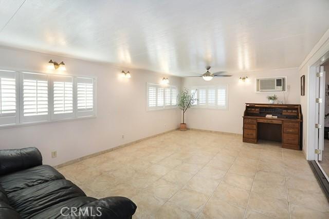 8121 San Mateo Cir, Buena Park, CA 90620 - living room with ceiling fan and a wall mounted air conditioner