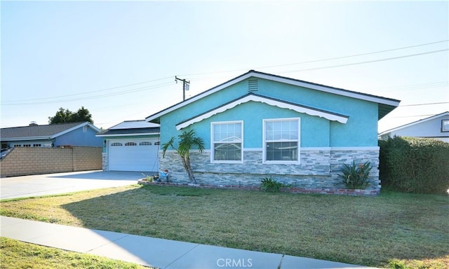 8121 San Mateo Cir, Buena Park, CA 90620 - view of front of house featuring a garage and a front lawn