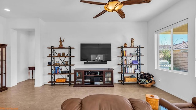 tiled living room with ceiling fan