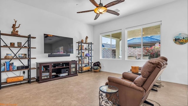 tiled living room featuring ceiling fan