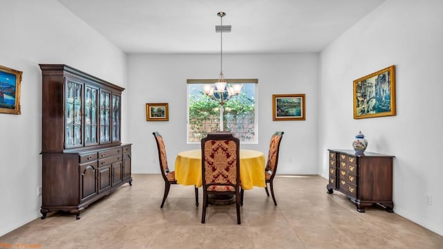 dining area with plenty of natural light and a notable chandelier