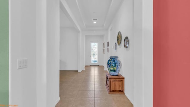 hallway with light tile patterned floors