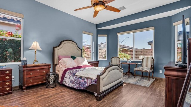 bedroom featuring ceiling fan and dark hardwood / wood-style flooring