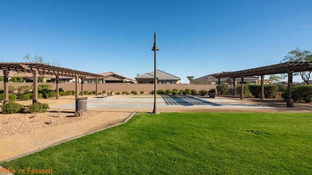 surrounding community with a pergola and a lawn