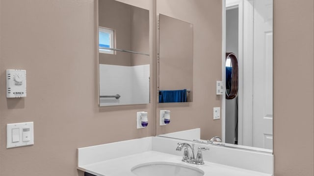 bathroom featuring vanity and walk in shower