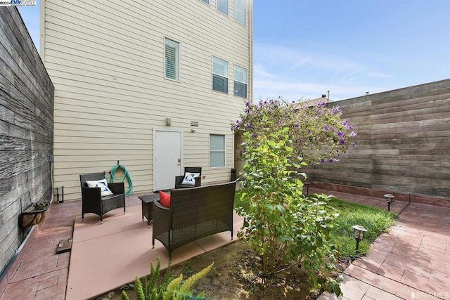 exterior space with an outdoor hangout area and a patio area