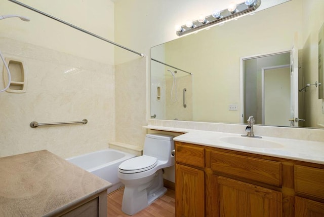 full bathroom with washtub / shower combination, hardwood / wood-style floors, vanity, and toilet