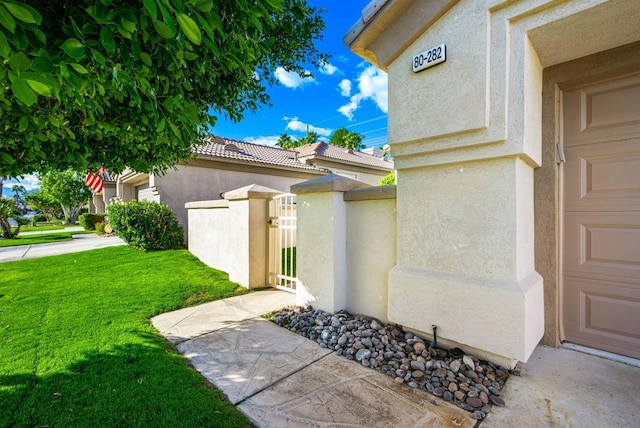 property entrance with a yard