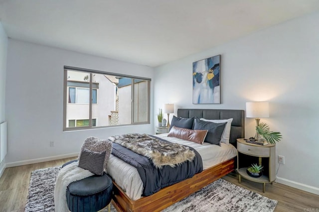 bedroom with hardwood / wood-style floors