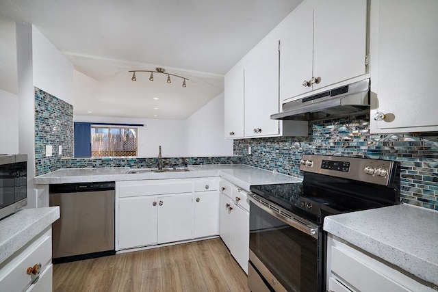 kitchen featuring backsplash, sink, and stainless steel appliances