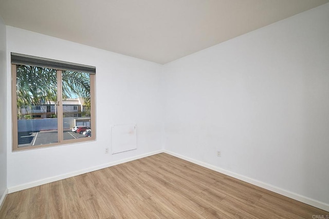 empty room with light hardwood / wood-style floors