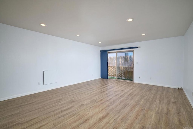 unfurnished room with light hardwood / wood-style floors