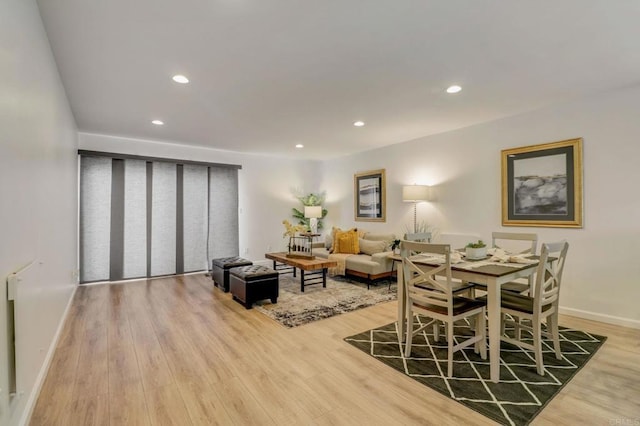 dining space featuring hardwood / wood-style floors