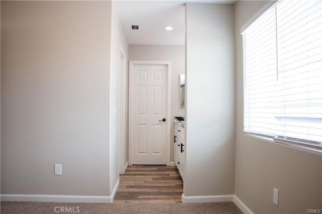 hall with dark wood-type flooring