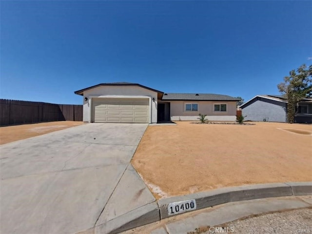 ranch-style house featuring a garage