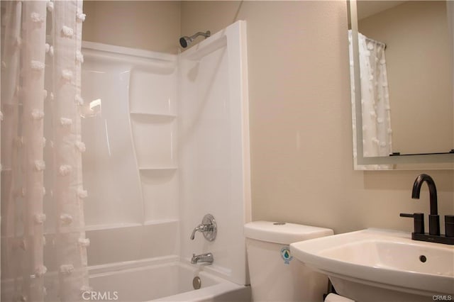 full bathroom featuring shower / tub combo, toilet, and sink