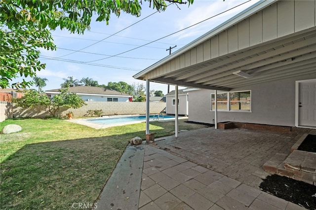 view of patio / terrace featuring a fenced in pool