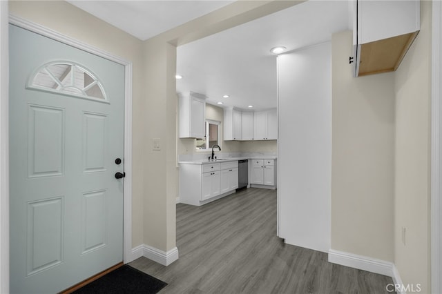 entryway featuring light hardwood / wood-style floors and sink