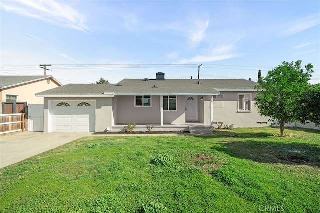 single story home with a garage and a front lawn