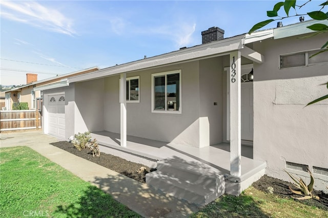 rear view of property with a garage