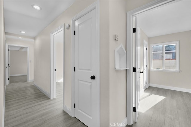 hallway featuring light hardwood / wood-style flooring