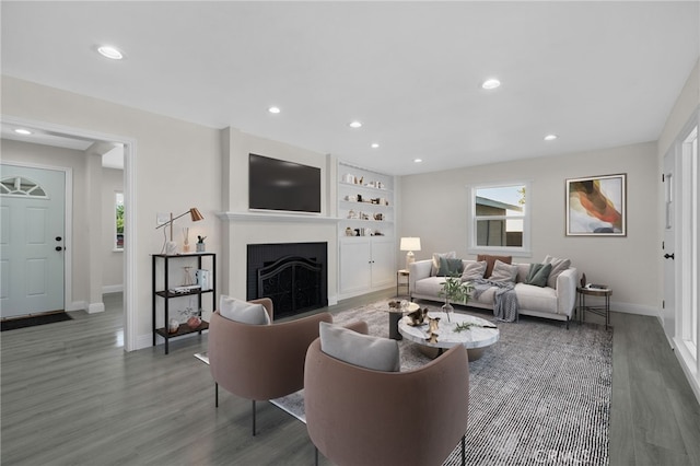 living room with dark hardwood / wood-style flooring