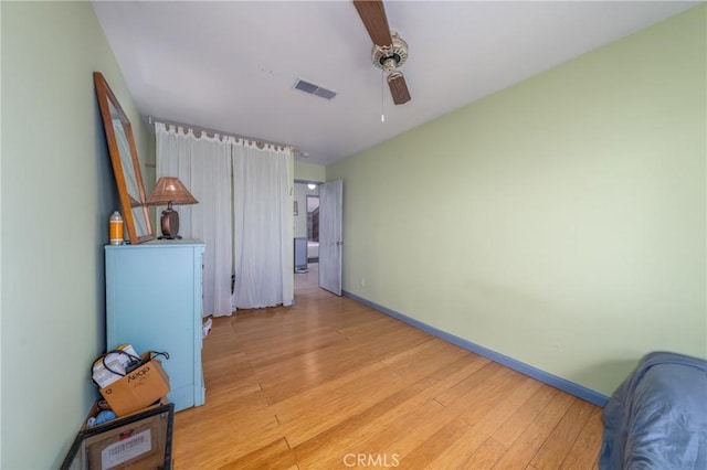 bedroom featuring ceiling fan and light hardwood / wood-style flooring