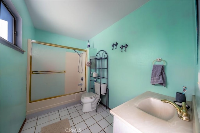 full bathroom featuring enclosed tub / shower combo, vanity, toilet, and tile patterned floors