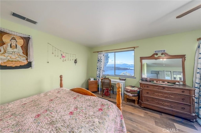 bedroom featuring ceiling fan and light wood-type flooring