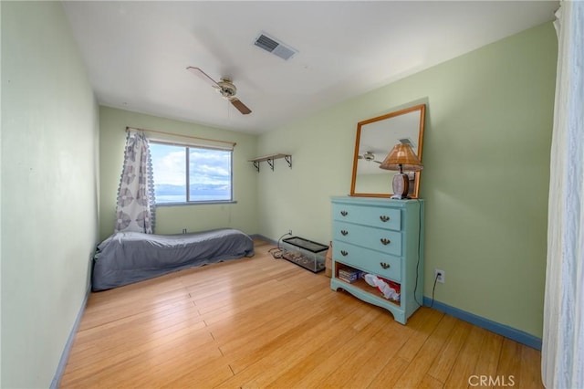 bedroom featuring ceiling fan and wood-type flooring