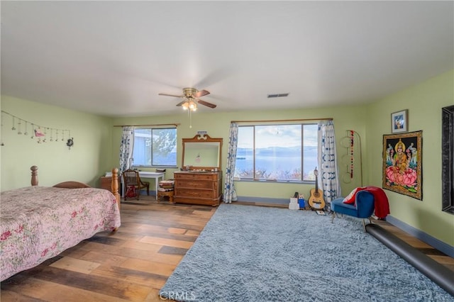 bedroom featuring dark hardwood / wood-style floors and ceiling fan