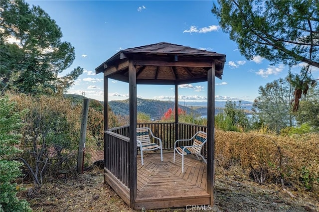 wooden terrace featuring a gazebo and a mountain view