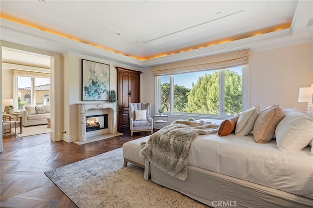 7 Shoreview, Newport Coast, CA 92657 - bedroom featuring a raised ceiling, multiple windows, crown molding, and a multi sided fireplace