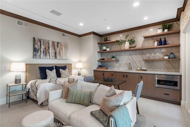 bedroom featuring crown molding and sink