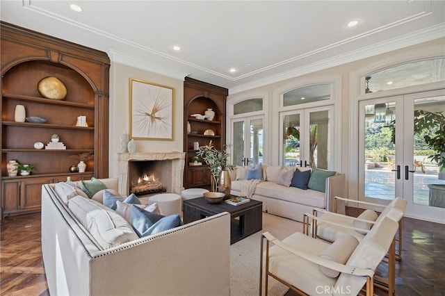 7 Shoreview, Newport Coast, CA 92657 - living area featuring french doors, healthy amount of natural light, crown molding, built in shelves, and a premium fireplace