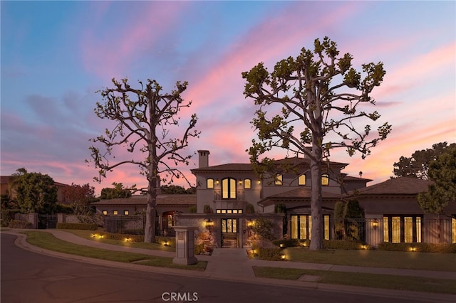 7 Shoreview, Newport Coast, CA 92657 - view of front of house featuring a chimney and stucco siding